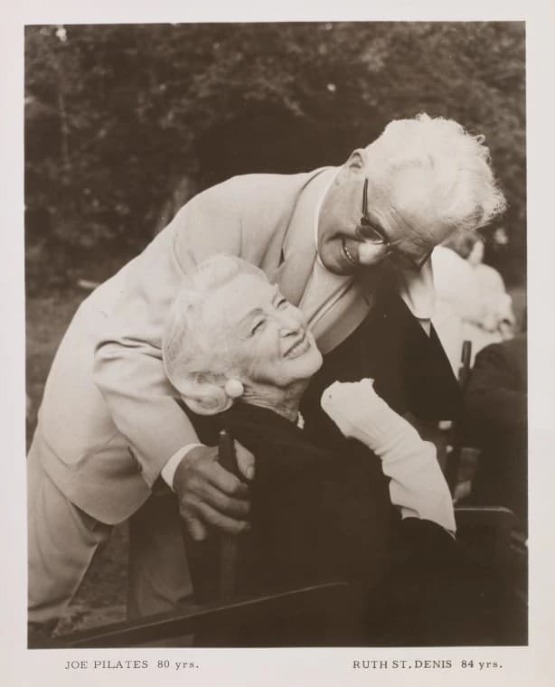 Joseph Pilates, age 80, embracing his client and friend Ruth St. Denis, age 84, the modern-dance pioneer